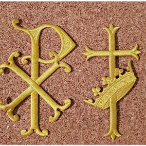 May include: Two gold embroidered patches, one with a stylized Christian cross and a crown, and the other with the Chi Rho symbol, a monogram of the first two letters of Christ's name in Greek.