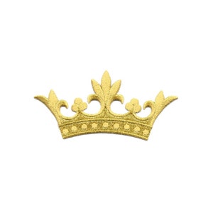 May include: A gold crown with a detailed design. The crown has a pointed top and five points on each side.