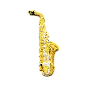 May include: A yellow and white embroidered saxophone patch. The patch is detailed with white stitching and a black mouthpiece.