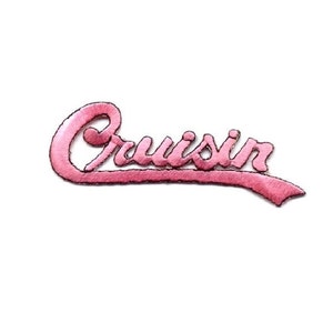 May include: Pink embroidered patch with the word "Cruisin'" in a cursive font.