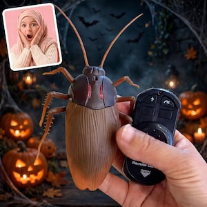 May include: A brown remote-controlled cockroach toy with two long antennae, six spiky legs, and two red glowing eyes on its back, held alongside a black handheld remote control featuring directional arrow buttons and a battery compartment label.