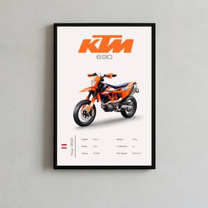 May include: A framed poster featuring a bright orange and black KTM 690 motorcycle centred on a white background. The text KTM 690 appears at the top. Below the motorcycle, technical specifications are listed including engine, power, torque, weight, and speed data, alongside the year 2023 and a small Austrian flag icon.
