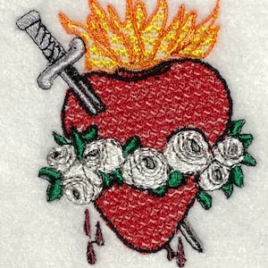 May include: Embroidered image of a red heart with a golden flame, a sword piercing it, and a white rose wreath. The heart is dripping with red drops.