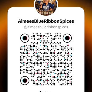 May include: A white square TikTok QR code featuring the username AimeesBlueRibbonSpices and handle @aimeesblueribbonspices. At the top, a circular profile image shows a person with blonde hair wearing a blue shirt, surrounded by spice jars.