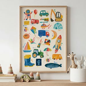 May include: A vertical rectangular wall art print featuring a colorful watercolor alphabet illustration. Each letter is paired with a corresponding object, including an astronaut, balloon, car, digger, envelope, fire engine, guitar, helicopter, igloo, jug, kite, lorry, moon, nest, origami, paintbrush, quilt, rocket, sailboat, tractor, umbrella, van, wellies, x-ray, yarn, and zeppelin.
