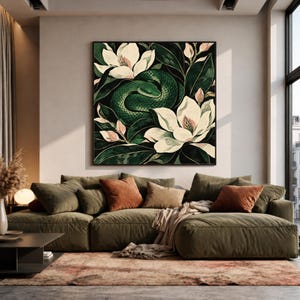 May include: A square wall art print featuring a coiled green snake nestled among large white magnolia flowers and dark green leaves. The artwork uses a deep colour palette with high contrast between the white petals and the dark foliage.