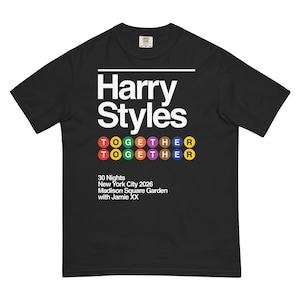 May include: A black short-sleeve t-shirt featuring white text that reads Harry Styles. Below this, the word TOGETHER is printed twice in colorful circles. Additional white text reads 30 Nights New York City 2026 Madison Square Garden with Jamie XX.