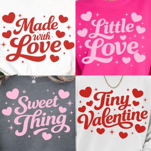 May include: Four sweatshirts with Valentine's Day themed designs. The sweatshirts are white, pink, gray, and white. The designs include the phrases "Made with Love", "Little Love", "Sweet Thing", and "Tiny Valentine", each with heart and star accents.