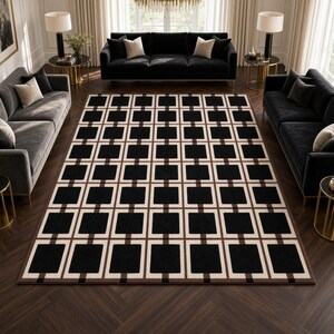 May include: A rectangular area rug featuring a repeating geometric pattern of solid black squares framed by thick cream-colored borders and thin brown lines, creating a structured grid layout across the entire surface of the floor covering.