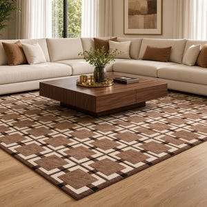 May include: A large rectangular area rug featuring a repeating geometric pattern of brown squares outlined in white and dark brown borders. The rug covers a significant portion of the light-toned wooden floor, providing a structured visual element.