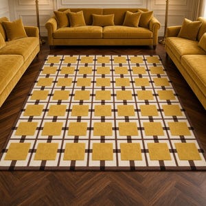 May include: A rectangular area rug featuring a repeating geometric grid pattern. The design consists of mustard yellow squares centered within white squares, all framed by thin dark brown lines that intersect to form a consistent lattice structure.