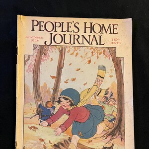 May include: Vintage "People's Home Journal" magazine cover from November 1926. The illustration depicts children playing in an autumn scene with falling leaves. The cover features the magazine title and price.