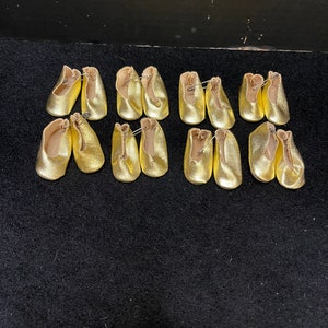 Eight pair soft gold lame doll shoes