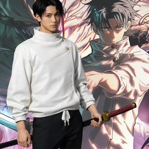 May include: A white high-collar jacket with an asymmetrical front closure featuring two gold-toned buttons, paired with black trousers featuring a white drawstring waist. The jacket has long sleeves with ribbed cuffs and a smooth, solid finish.