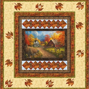 May include: A quilted wall hanging featuring a pastoral autumn scene. The central image depicts a farmhouse and barn along a dirt road, surrounded by trees in fall colors. The quilt has a leaf pattern border in shades of orange, brown, and cream.