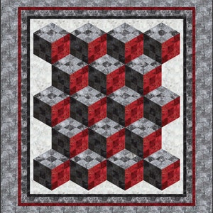 May include: A quilt with a geometric pattern of red, black, and gray cubes. The cubes are arranged in a repeating pattern, creating an optical illusion of depth.