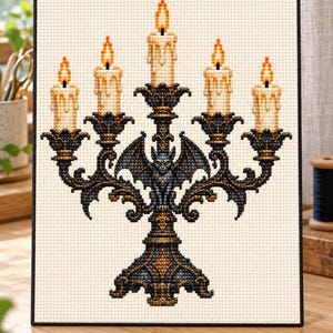 May include: A cross-stitch pattern on cream fabric featuring a dark blue and gold ornate candelabra with a central bat figure. Five lit candles with orange and yellow flames sit in the holders, with wax drips depicted on the sides.