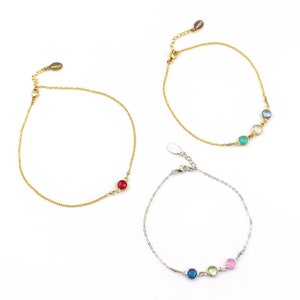 3 gemstone anklets in assorted silver and gold, each with different stones. Garnet, grounding crystals, root chakra jewelry, kyanite, inner wisdom, 3rd eye crystals, green amethyst, intuition, pink chalcedony, friendship crystals, heart crystals