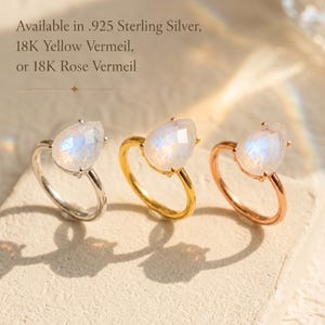 Moonstone teardrop rings shown in .925 sterling silver, 18K yellow vermeil, and 18K rose vermeil finishes with text overlay. A June birthstone ring available in silver, gold, and rose gold, perfect as a birthday gift, gift for her, or gemstone ring.