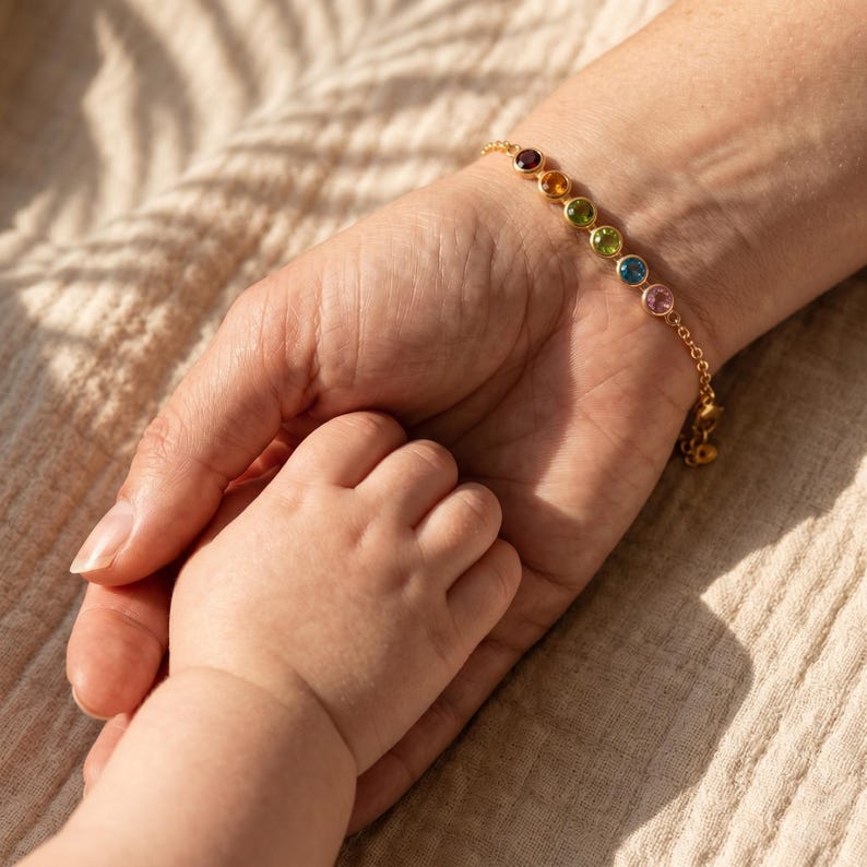 Personalized bar bracelet with colorful birthstones and a delicate chain, styled as a minimalist family keepsake for women who love meaningful jewelry.