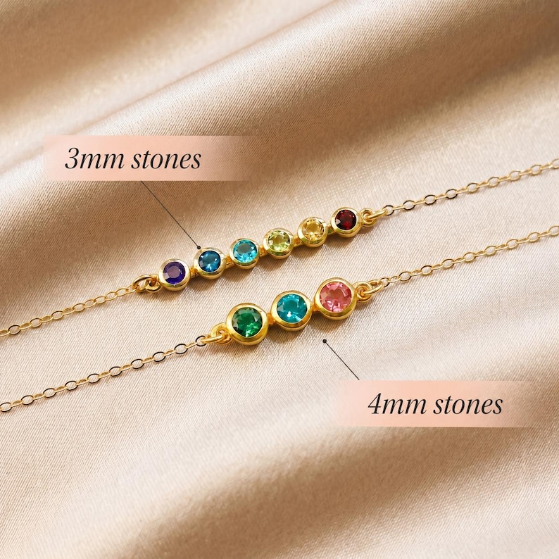 Custom mom birthstone bracelet with tiny gemstone accents on a slim chain, designed to symbolize children or grandchildren in a refined handmade jewelry piece.