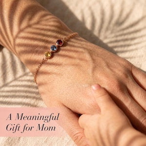 Sterling silver birthstone bracelet with a dainty gemstone bar and fine chain, handmade as a personalized family jewelry gift for mom, grandma, or loved ones.