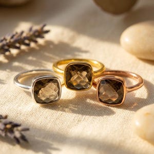 Smoky quartz ring worn on hand neutral styling soft natural lighting