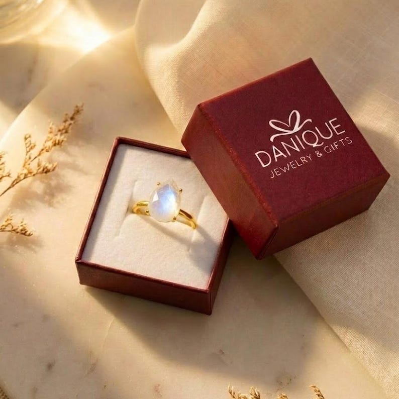 Danique Jewelry gift box with moonstone teardrop ring, showing gift-ready packaging for a June birthstone ring. A thoughtful presentation for birthday gifts, bridesmaid gifts, Mother’s Day, Christmas, anniversaries, and special gifts for her.