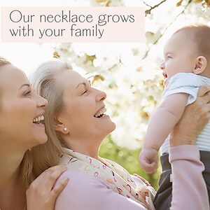 Generational family photo with grandmother, mother, and baby smiling outdoors under spring blossoms, symbolizing love and legacy. Marketing image for personalized birthstone necklace that grows with your family, featuring custom gemstones for kids, grandkids, and mom. Sentimental jewelry gift idea for Mother’s Day, grandma birthday, new mom celebration, family keepsake, or anniversary present. Perfect heirloom necklace to honor motherhood, milestones, and meaningful connections.