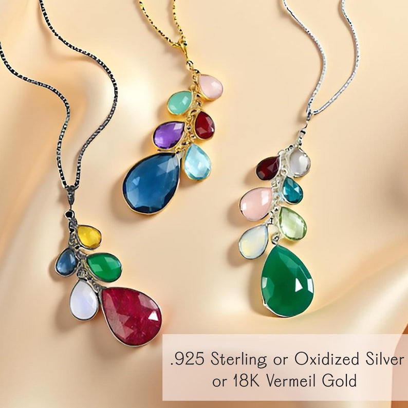 Three handmade family tree necklaces with multicolor teardrop birthstones displayed in .925 sterling silver, oxidized silver, and 18K gold vermeil settings. Each layered pendant design features large, medium, and small gemstones symbolizing generations, creating a unique heirloom necklace for grandma, mom, or wife. A custom multicolor birthstone pendant, perfect as a sentimental keepsake, birthday gift, anniversary jewelry, or statement necklace for everyday layering.