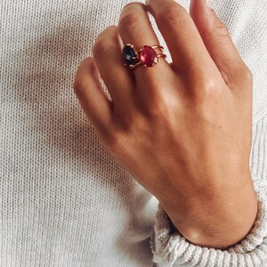 roduct image of moonstone teardrop ring on white background, showing the pear-shaped gemstone, prong setting, and gold band clearly for shoppers. A clean view of the June birthstone ring, gemstone ring, rainbow moonstone ring, and gift for her.