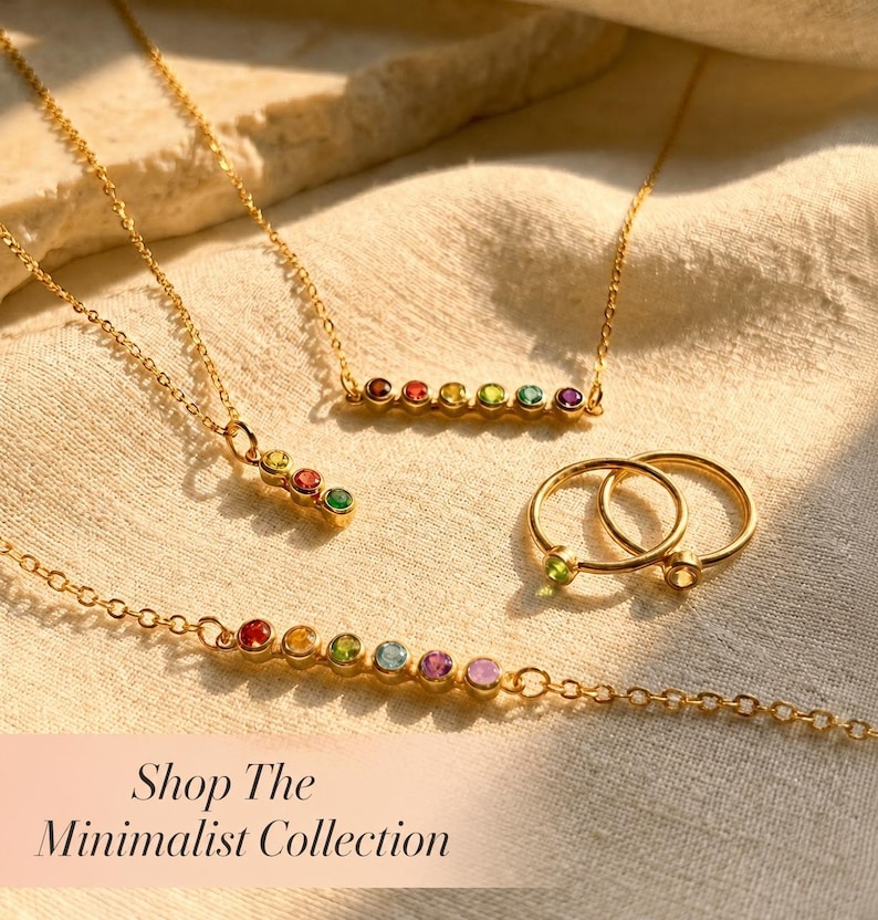 A minimalist birthstone collection featuring necklaces, bracelets and rings. The text on the image says "Shop the Minimalist Collection"