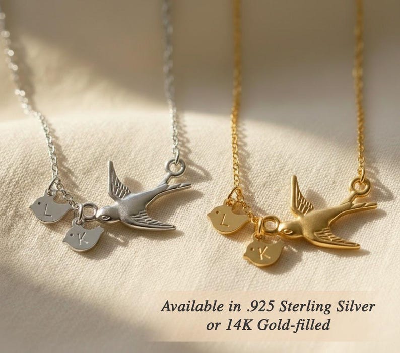 Metal options comparison photo showing silver and gold mama bird necklaces, personalized initial charm jewelry available in 925 sterling silver or gold-filled finish.