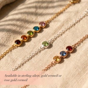 Personalized family birthstone bracelet with small round bezel gemstones representing loved ones, shown in a delicate minimalist style for everyday wear and meaningful gifting.