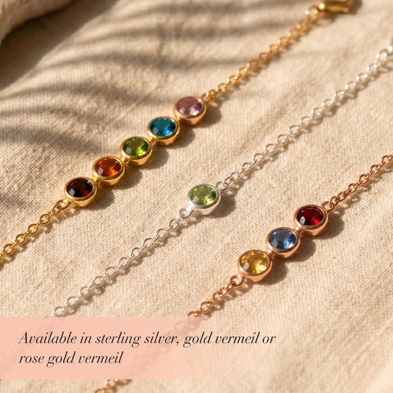 Personalized family birthstone bracelet with small round bezel gemstones representing loved ones, shown in a delicate minimalist style for everyday wear and meaningful gifting.