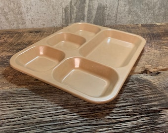 May include: A brown plastic tray with five compartments, ideal for serving food or snacks.