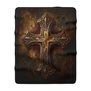 May include: A rectangular throw blanket featuring a central ornate cross design with weathered metallic gold and dark brown tones. The background displays a dark, textured surface with subtle gothic-inspired patterns and cracked paint effects.