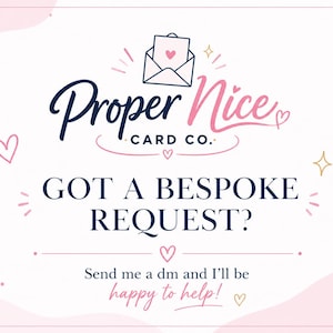 May include: A white graphic sign featuring the text Proper Nice CARD CO. with an envelope icon containing a heart. Below, the text reads GOT A BESPOKE REQUEST? followed by Send me a dm and I'll be happy to help! The design includes pink hearts and gold stars.