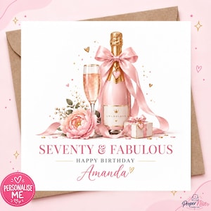 May include: A square birthday greeting card featuring a champagne bottle with a pink ribbon, a champagne flute, a pink peony, and a small gift box. The text reads SEVENTY & FABULOUS HAPPY BIRTHDAY Amanda in pink and black lettering.
