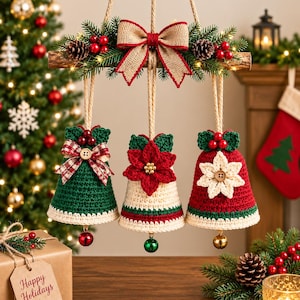 May include: A hanging Christmas decoration featuring three crocheted bells suspended from a wooden branch. The bells are green, cream, and red, adorned with fabric bows, buttons, and poinsettia motifs. The branch is decorated with pine needles, pinecones, red berries, and a burlap bow.