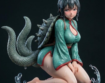 May include: A detailed anime-style figurine of a character with short dark hair, wearing a teal patterned dress with red trim. The figure has a large turtle shell on its back and multiple scaly tails, kneeling on a rocky base with coral and water effects.