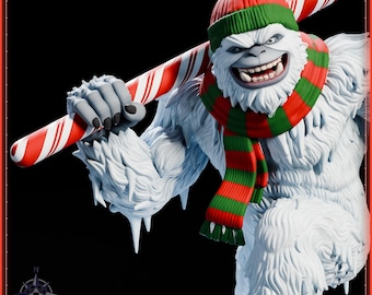 May include: A white yeti figurine with a textured fur appearance, wearing a red and green knit hat with a pom-pom and a matching striped scarf. The yeti holds a large red and white candy cane across its shoulders against a black background.