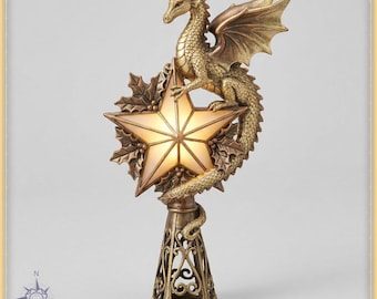 May include: A gold-toned dragon figurine perched atop a glowing, five-pointed star ornament. The star is framed by sculpted holly leaves and berries. The entire piece is supported by a conical, open-work metal base with intricate scrollwork.