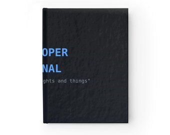Puede incluir: Un diario de tapa dura negra con una superficie texturizada. La portada presenta el texto azul "OPER" y "NAL" apilados verticalmente, seguido por el texto blanco más pequeño "thoughts and things" entre comillas en la parte inferior.
