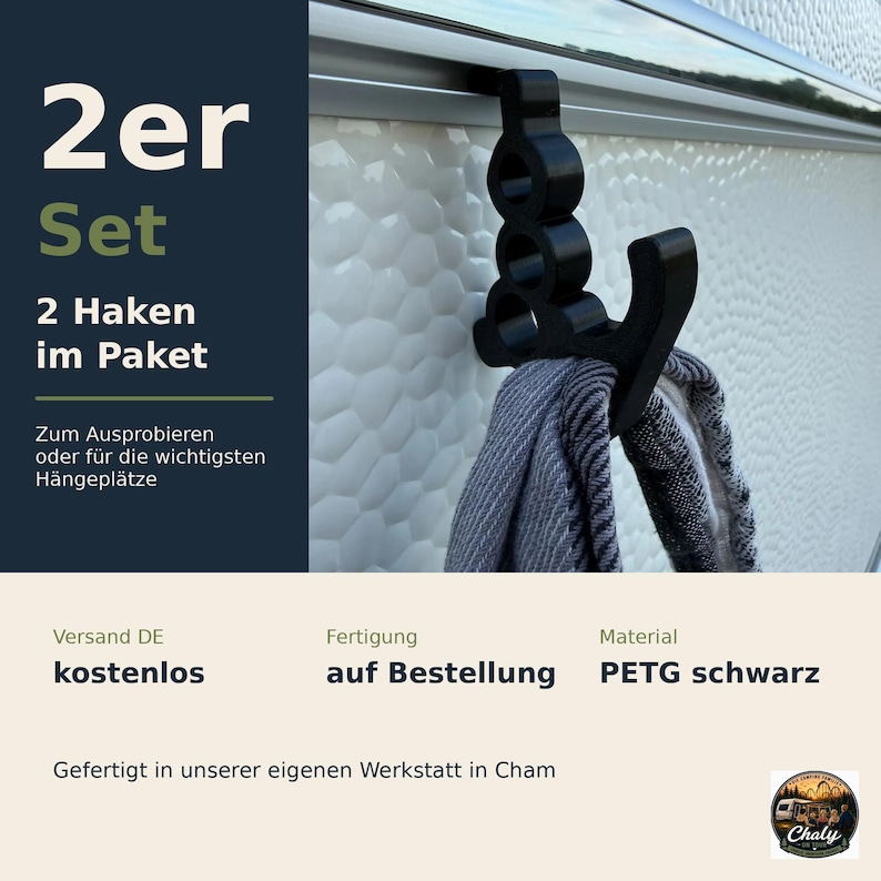 May include: A black plastic hook designed to slide onto a rail, featuring a vertical structure with three circular cutouts and a curved arm for hanging items. The text 2er Set, 2 Haken im Paket, Zum Ausprobieren oder f&uuml;r die wichtigsten H&auml;ngepl&auml;tze is visible.