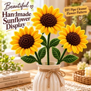 May include: Three sunflowers crafted from yellow and brown pipe cleaners, featuring green pipe cleaner stems and leaves, arranged in a white ribbed ceramic vase tied with a jute twine bow. Text reads: Beautiful Handmade Sunflower Display and DIY Pipe Cleaner Flower Pattern.