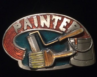 May include: A silver belt buckle with a red, orange, and green enamel design. The buckle features a paint roller, paint brush, and paint can with the word "PAINTER" in silver lettering.