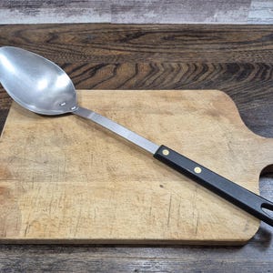 Cuchara de cocina Sharpcutter vintage, mango de acero inoxidable con compuesto negro, década de 1950, EE. UU.