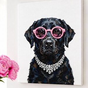 May include: A textured oil painting on canvas depicting a black Labrador retriever wearing bright pink round-rimmed sunglasses and a sparkling silver-toned statement necklace with multiple clear faceted stones against a plain white background.