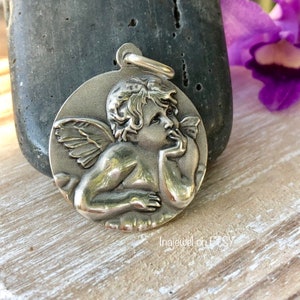 Raphael’s Cherub Pendant. Sterling Silver.